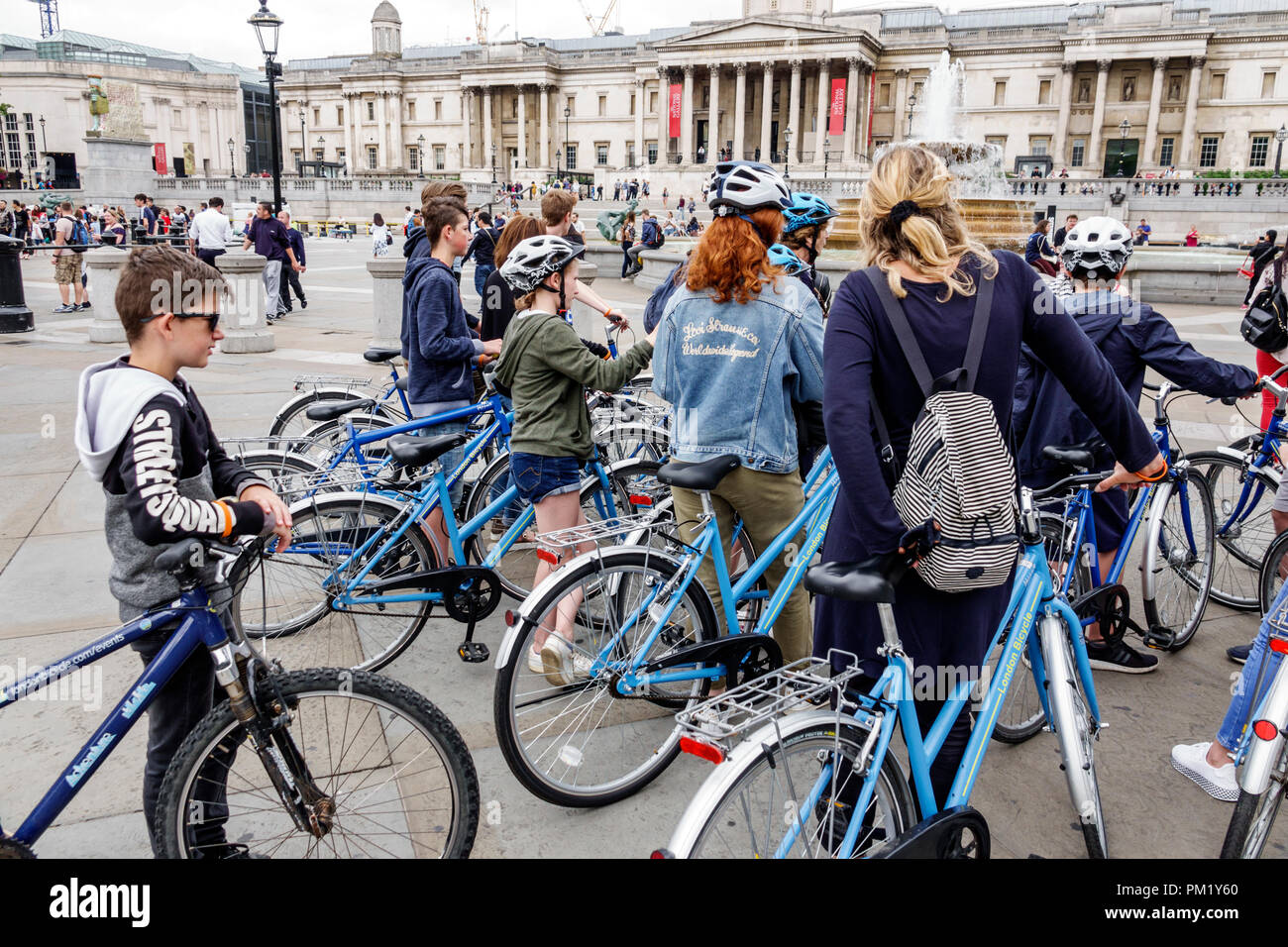 London England,UK,United Kingdom Great Britain,Trafalgar Square,guided bicycle,helmet,adult adults man men male,woman women female lady,girl girls,fem Stock Photo