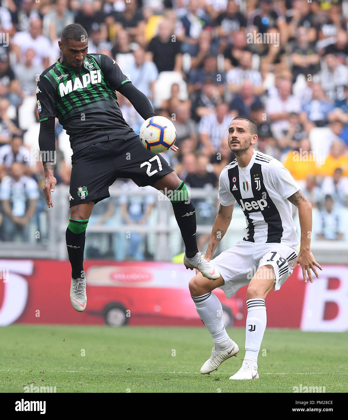 Turin, Italy. 16th Sep, 2018. FC Juventus' Leonardo Bonucci (R) vies with Sassuolo's Prince Boateng during the Serie A soccer match between FC Juventus and Sassuolo in Turin, Italy, Sept. 16, 2018. FC Juventus won 2-1. Credit: Alberto Lingria/Xinhua/Alamy Live News Stock Photo