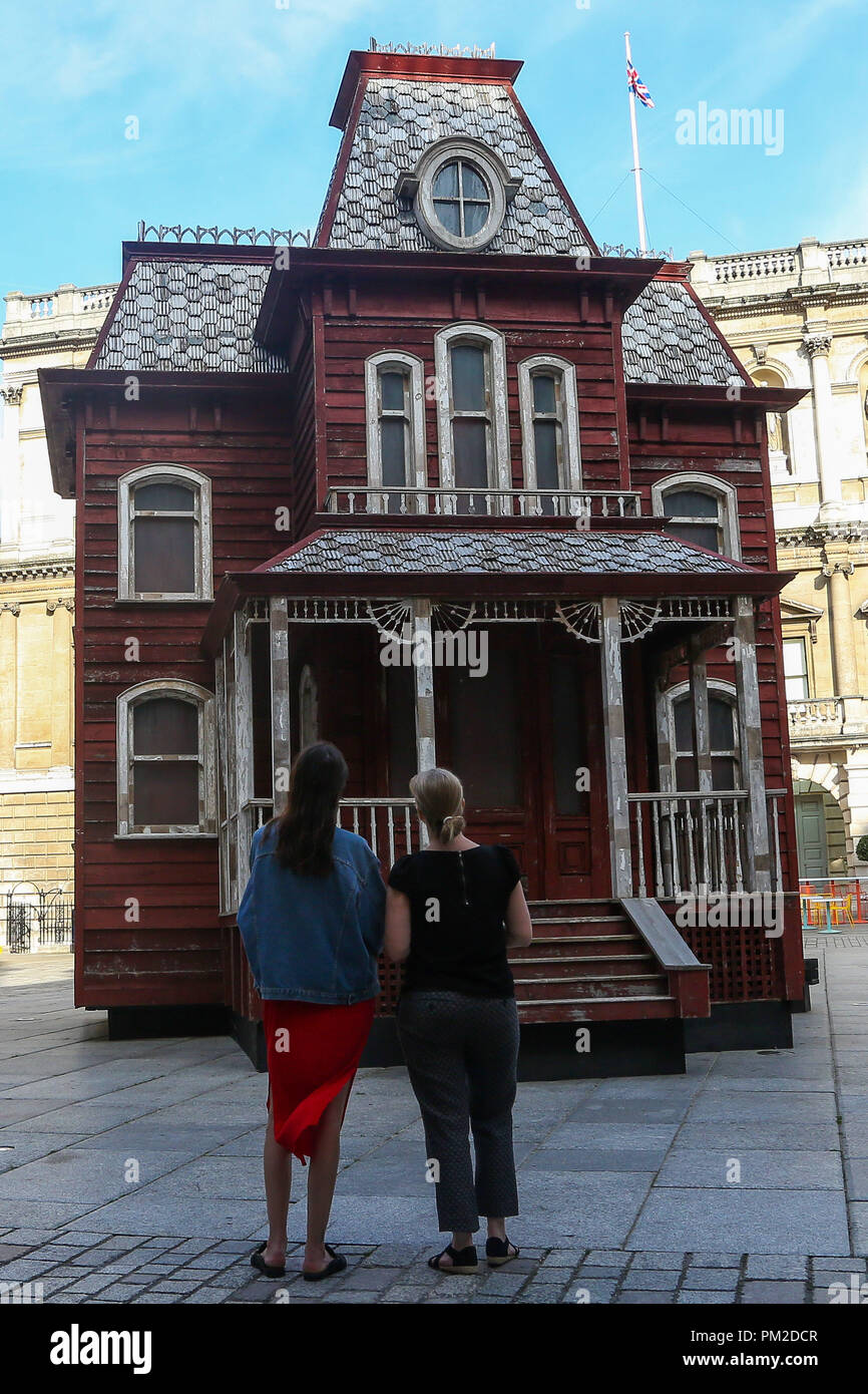 Royal Academy of Arts. London. UK. 17 Sept 2018 - Transitional Object (Psychobarn) a 30 feet (10m), made from the components of a dismantled traditional American red barn and based on the house seen in Alfred Hitchcock’s film Psycho (1960) on display at the Royal Academy of Arts’ courtyard from 18 September 2018 – March 2019.  Credit: Dinendra Haria/Alamy Live News Stock Photo
