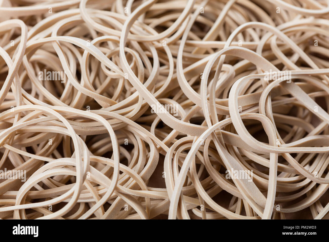 yellow Rubber Band close up for background Stock Photo - Alamy