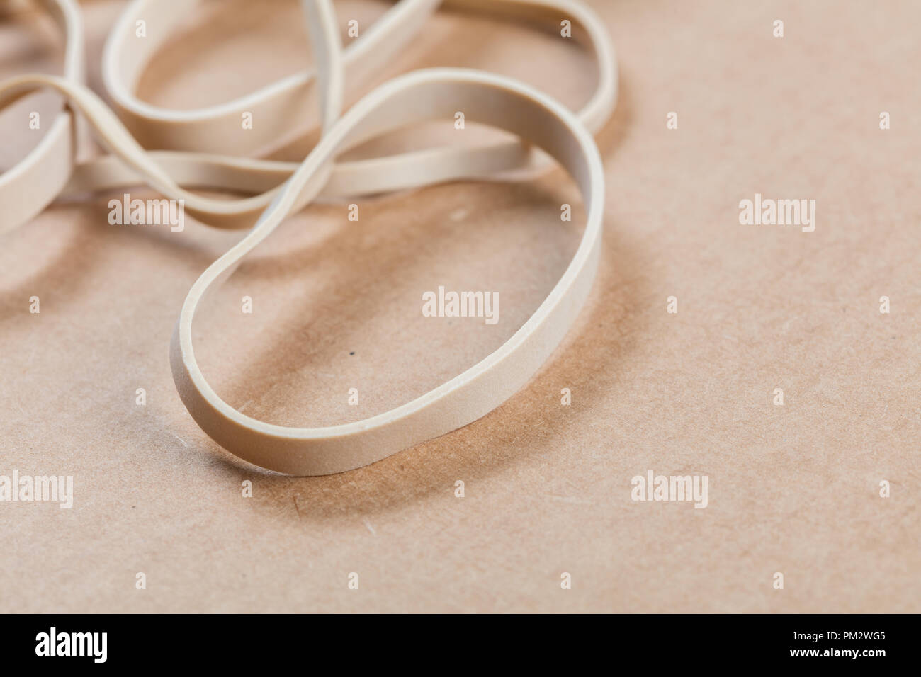 yellow Rubber Band close up for background Stock Photo - Alamy