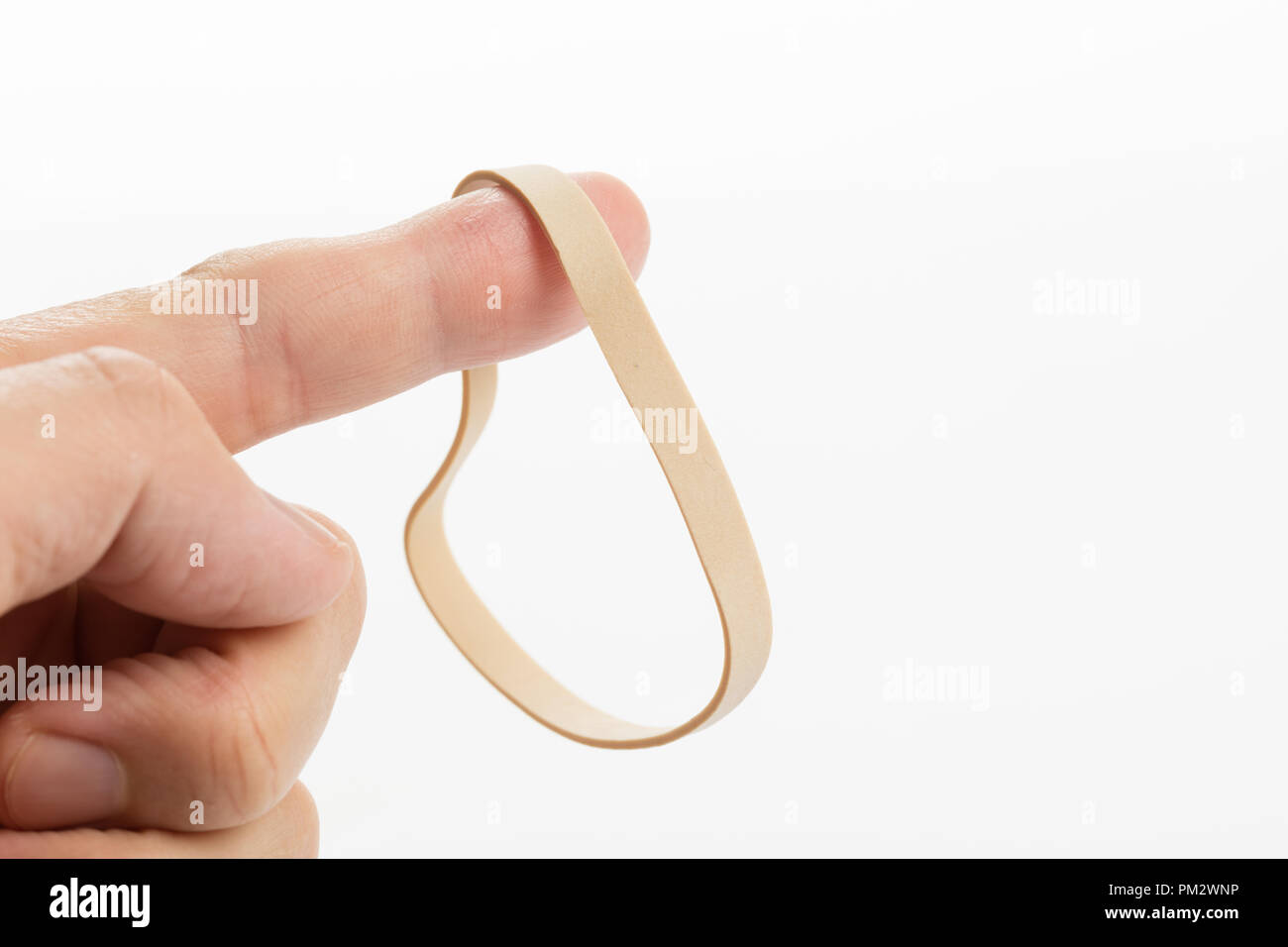 a yellow Rubber Band with white background Stock Photo - Alamy