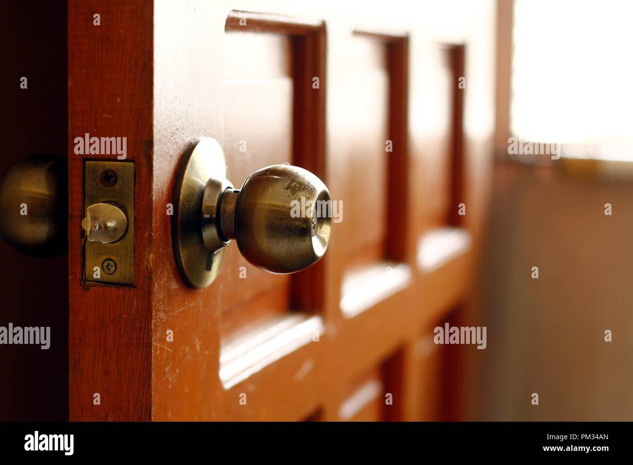 Photo of a door knob of a wooden door Stock Photo