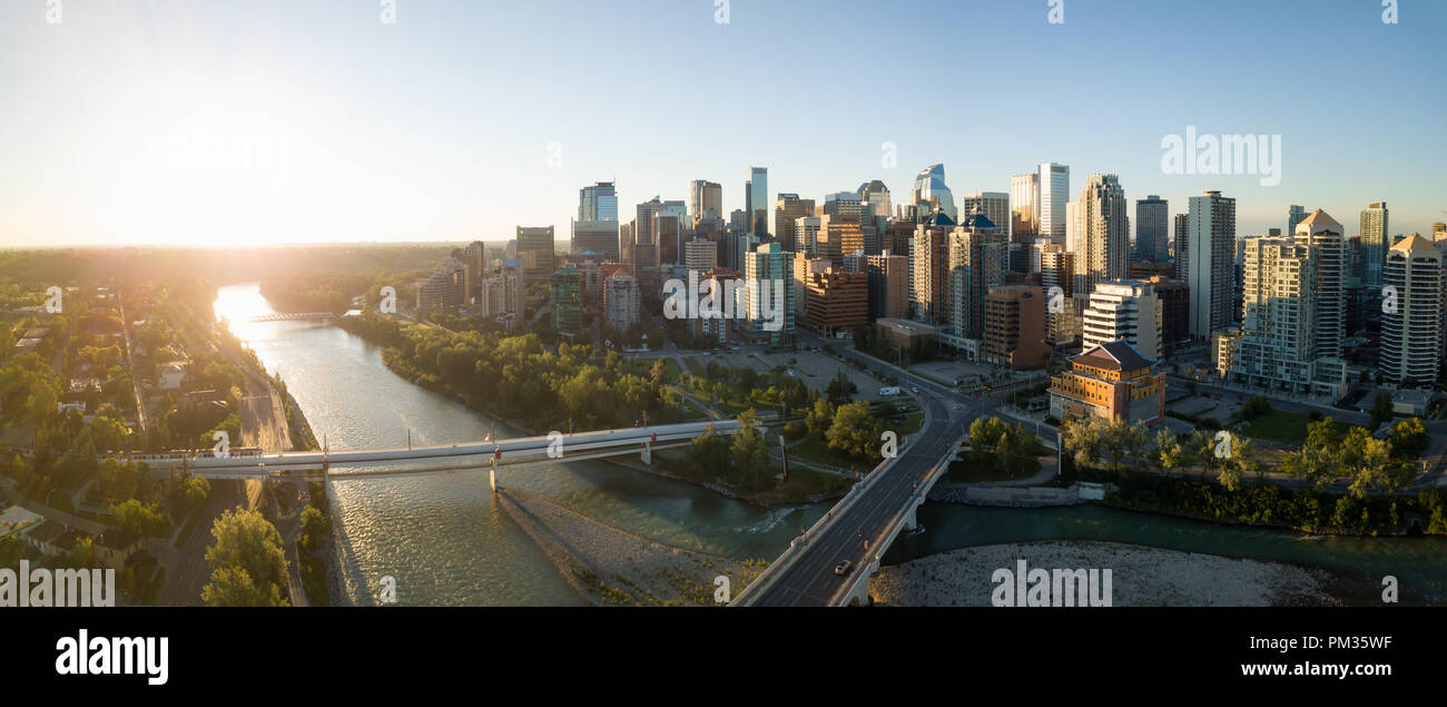 Aerial panoramic view of a beautiful modern cityscape during a vibrant sunny sunrise. Taken in Calgary Downtown, Alberta, Canada. Stock Photo