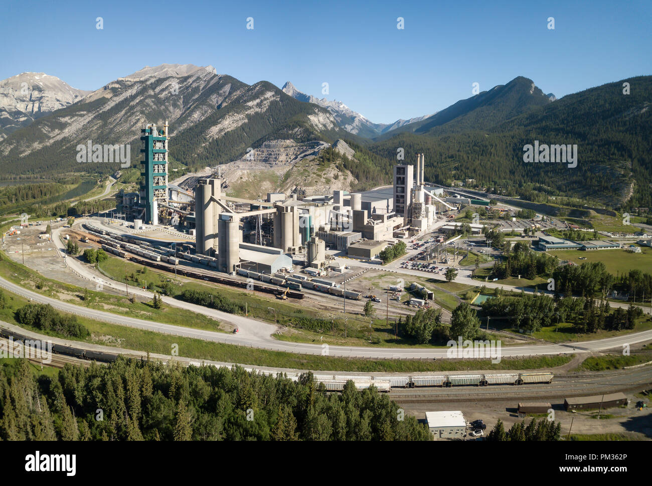 Aerial view of an industrial site in the Canadian Rockies during a vibrant sunny summer day. Taken near Calgary, Alberta, Canada. Stock Photo