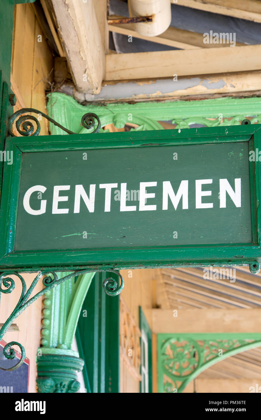 Green Gentleman Toilet Sign on Railway Station Platform Stock Photo - Alamy