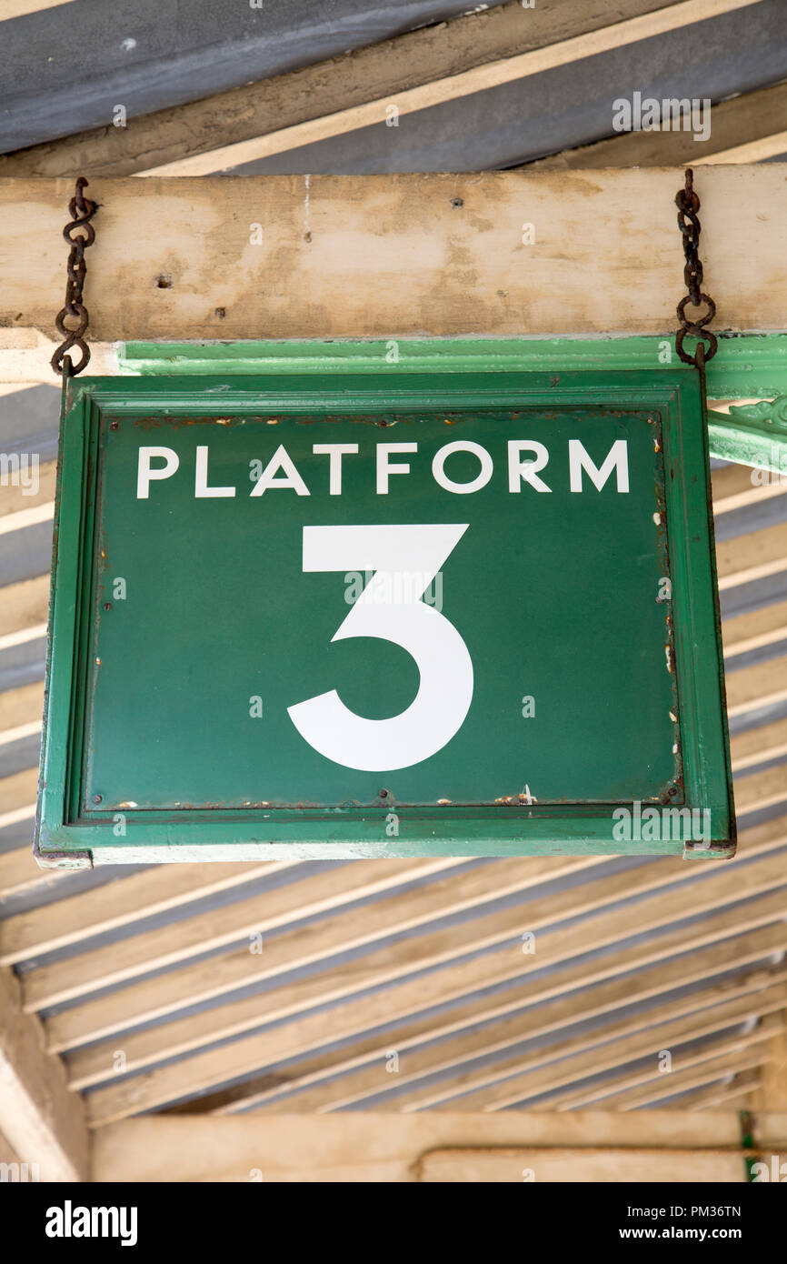 Hanging Green Platform Three Sign Stock Photo