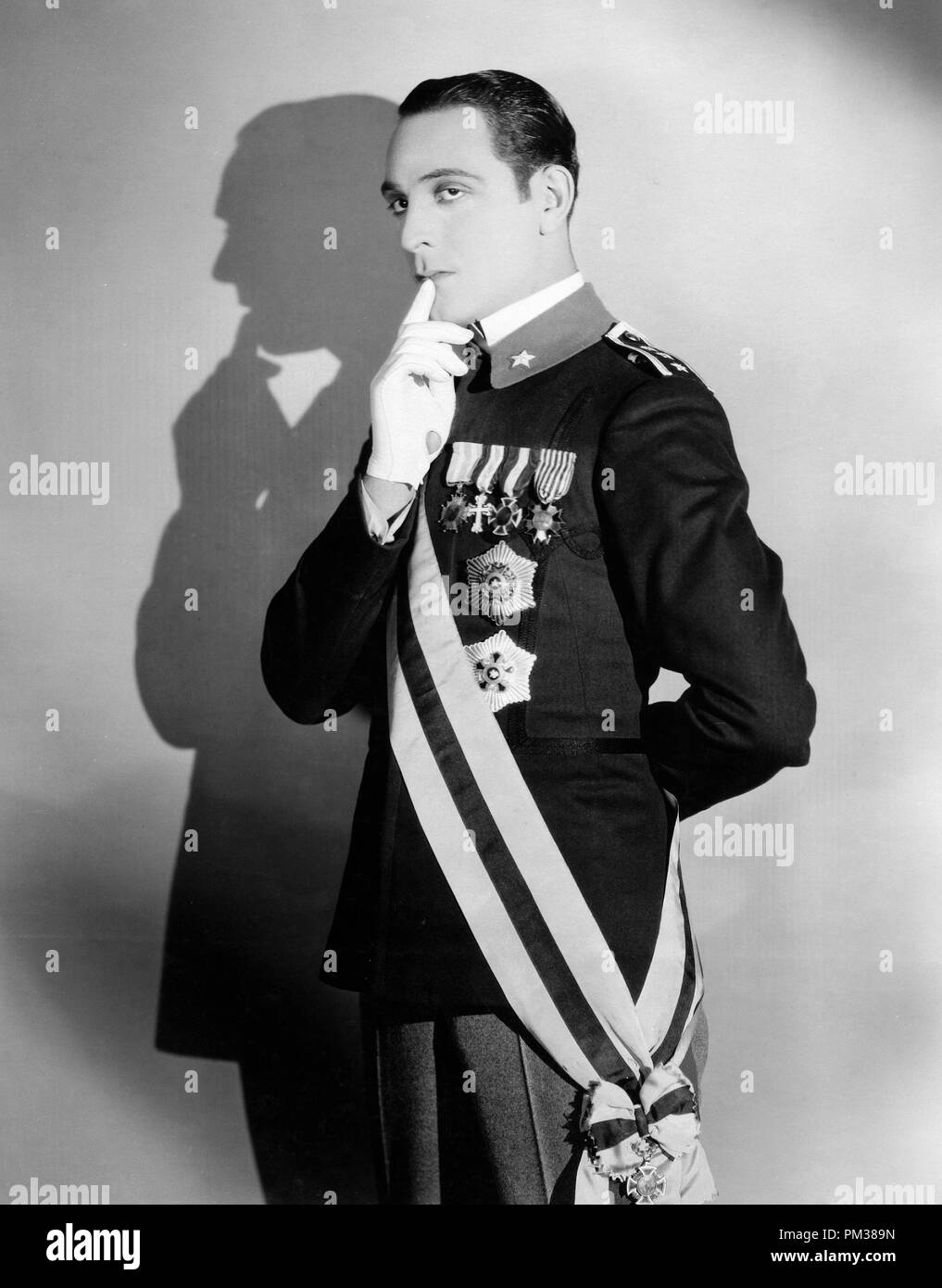 Silent film still. Portrait of a man wearing a high ranking military uniform with many medals pinned on his jacket, 1925.  File Reference # 1183 006THA Stock Photo