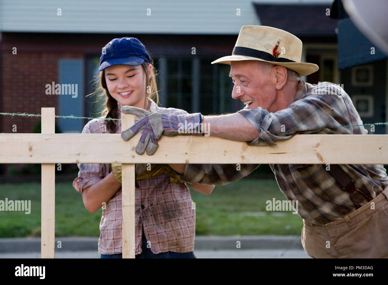 (L-r) MADELINE CARROLL as Juli Baker and JOHN MAHONEY as Chet Duncan in Castle Rock Entertainment’s coming-of-age romantic comedy “FLIPPED,” a Warner Bros. Pictures release. Stock Photo