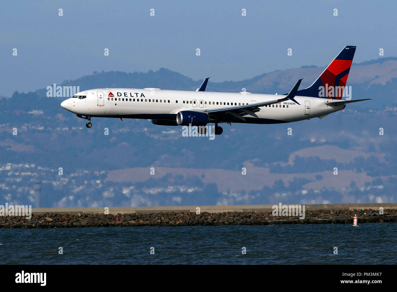 Boeing 737-932(ER) (N834DN) operated by Delta Air Lines landing at San Francisco International Airport (KSFO), San Francisco, California, United States of America Stock Photo