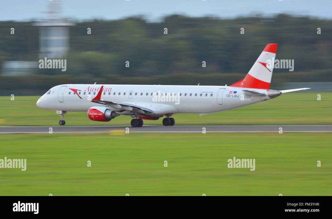 Austrian Airlines Embraer Erj-195 taking of a fter sunset at LOWG Graz airport, Austria Stock Photo