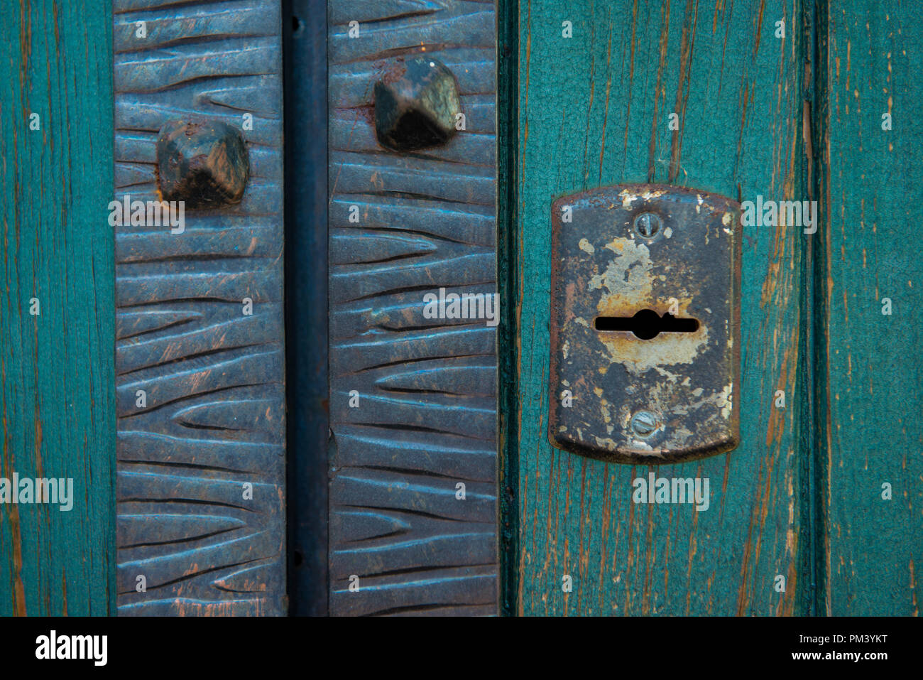 Old rusty and dusty keyhole wallpaper. Vintage keyhole on old wooden