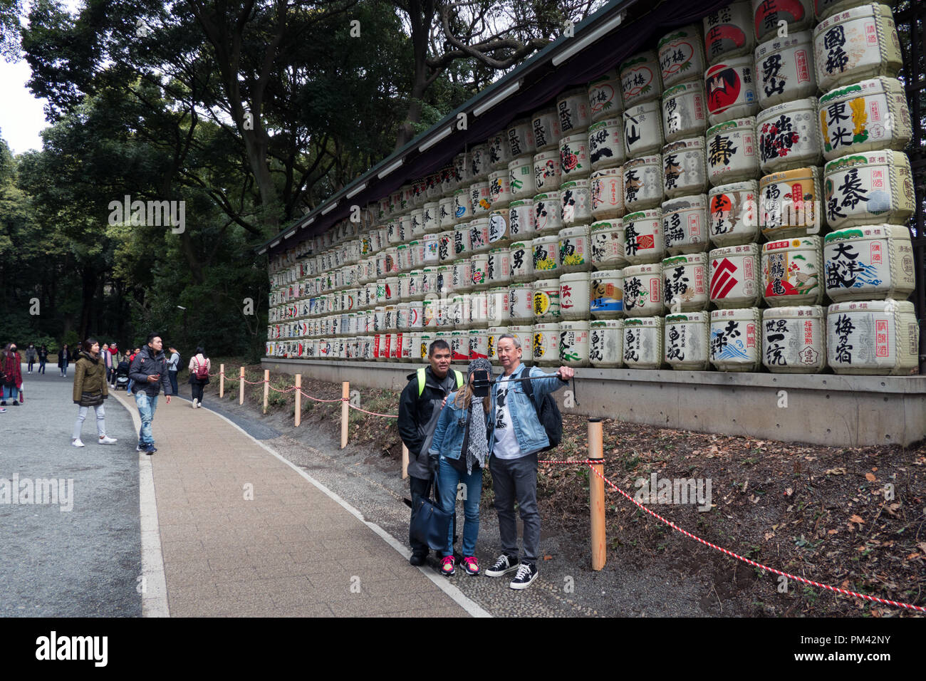 Monument made of sake barrels near Meiji Jingu or Meiji Jingo Shrine in Tokyo, Japan, Asia. People and tourists during visit Stock Photo