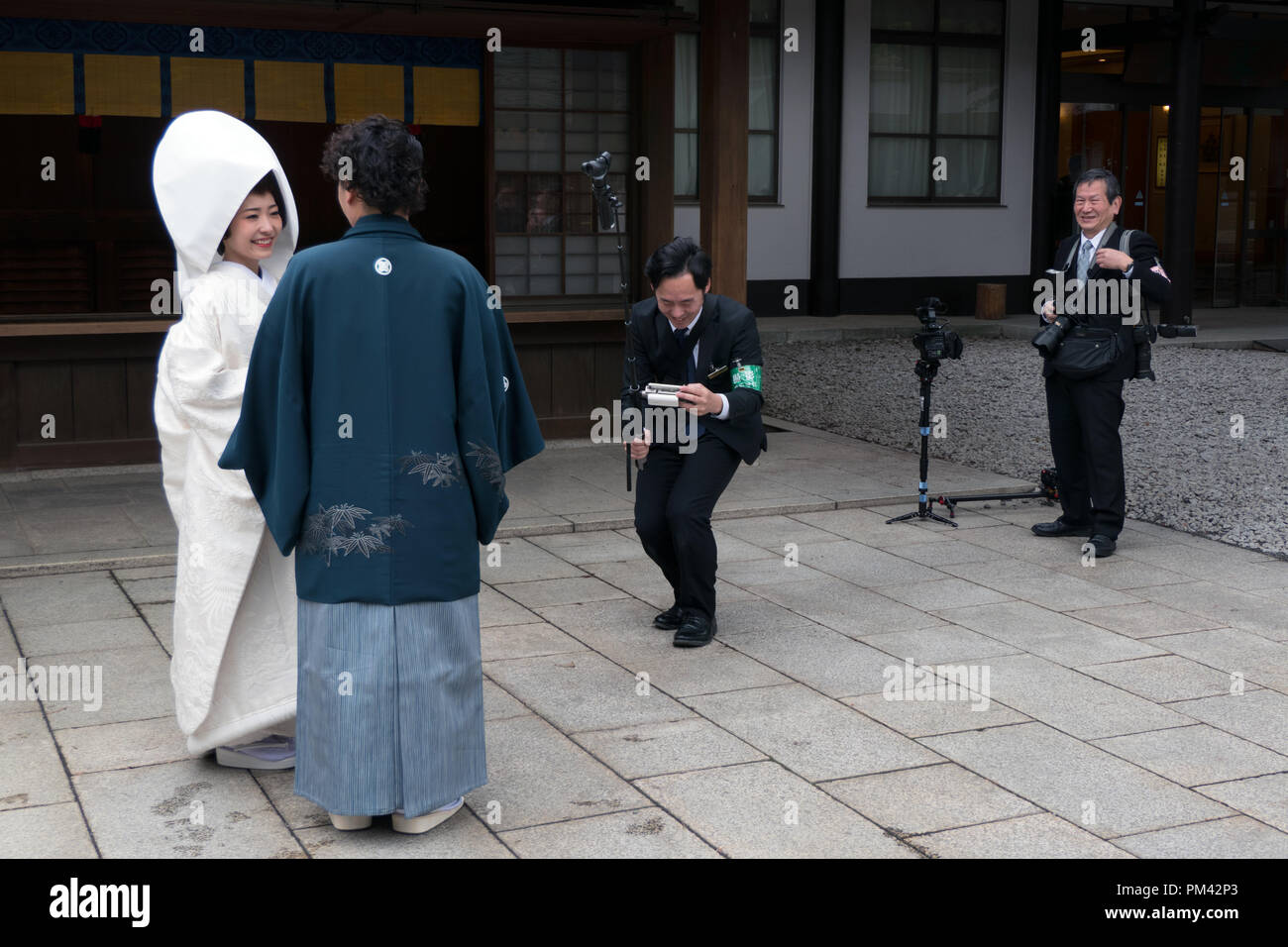 Photo shoot of a traditional Japanese wedding ceremony with bride and groom at Meiji Jingu Shrine in Tokyo, Japan, Asia Stock Photo