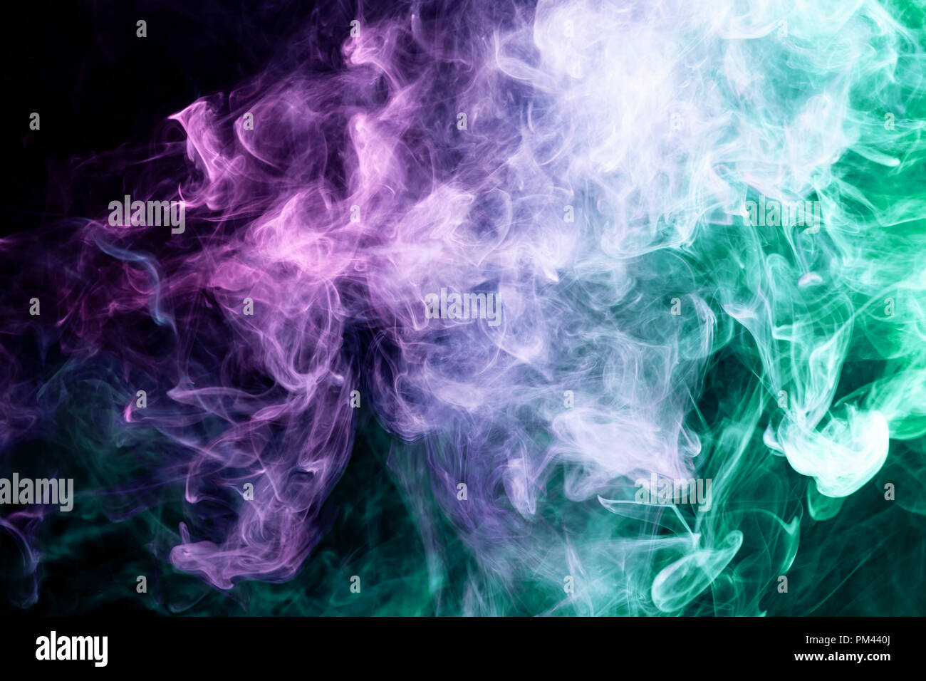 Green And Pink Steam On A Black Background Stock Photo - Download