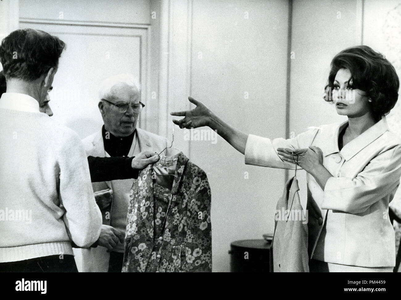 Sophia Loren and Charlie Chaplin check through some of the dresses on ...