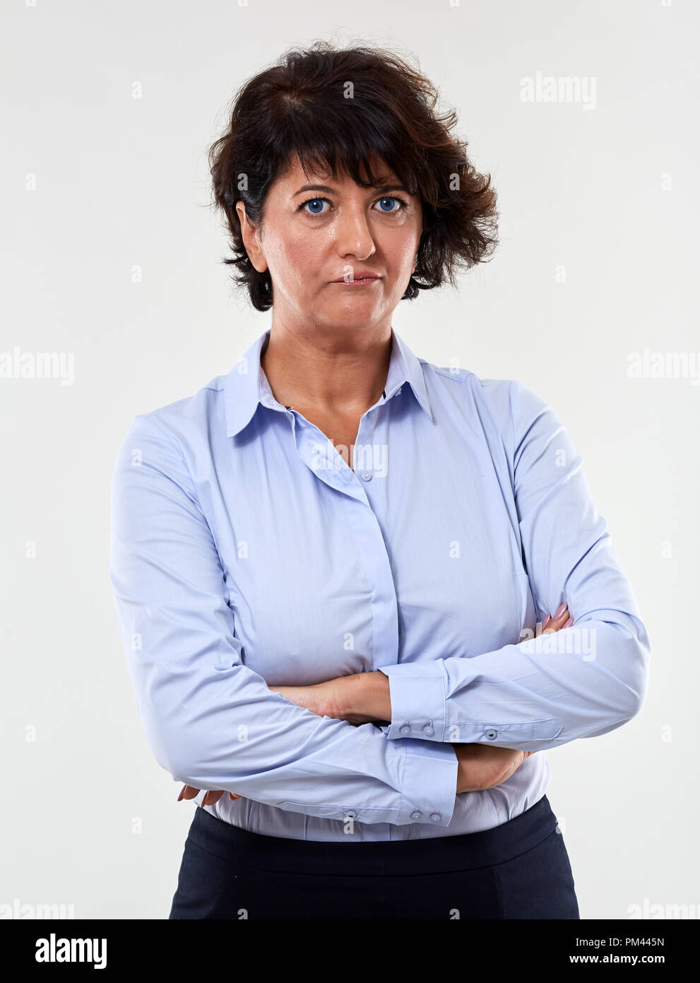 Portrait of a mature businesswoman with an expression of distrust Stock Photo