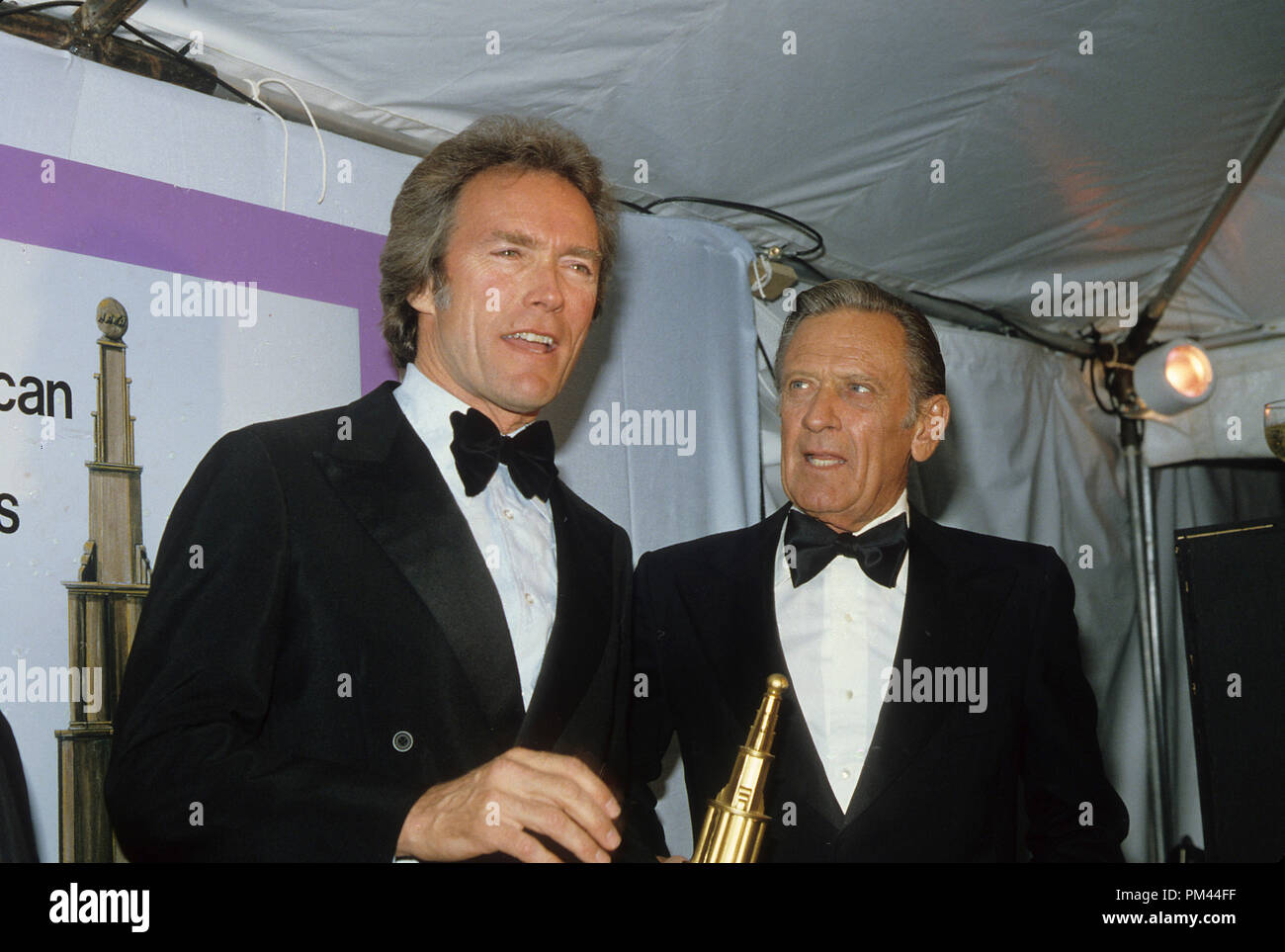 Clint Eastwood and William Holden, circa 1980. File Reference #1022_014THA © JRC /The Hollywood Archive - All Rights Reserved. Stock Photo