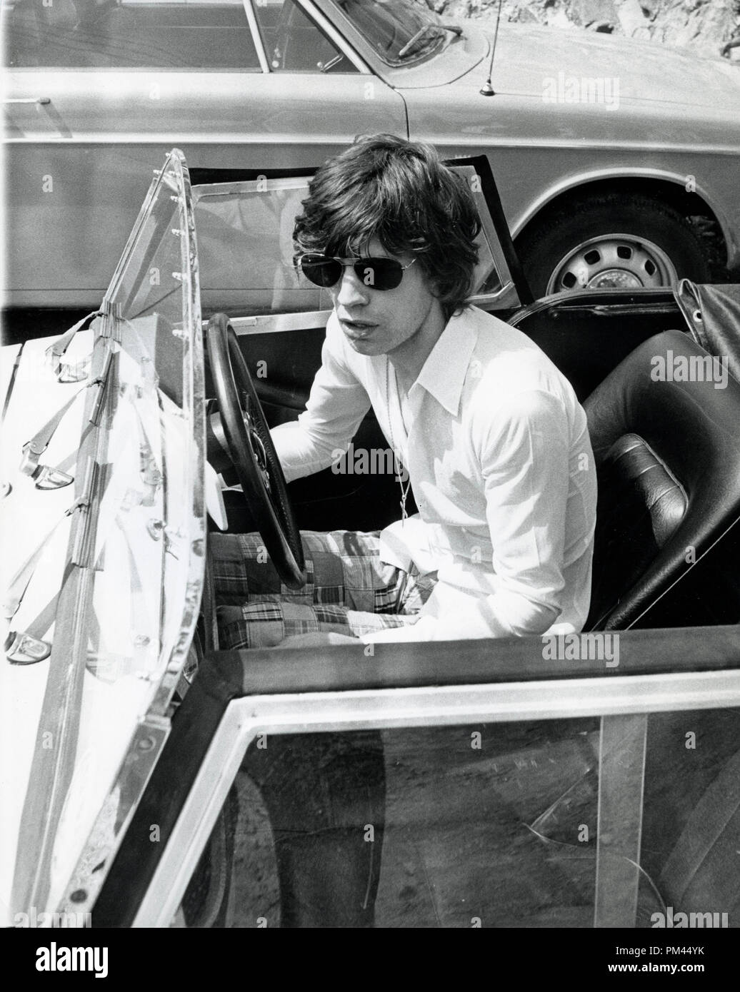 Mick Jagger behind the wheel of his small sport car in St.  Tropez, May1971. File Reference #1029 001THA © JRC /The Hollywood Archive - All Rights Reserved. Stock Photo