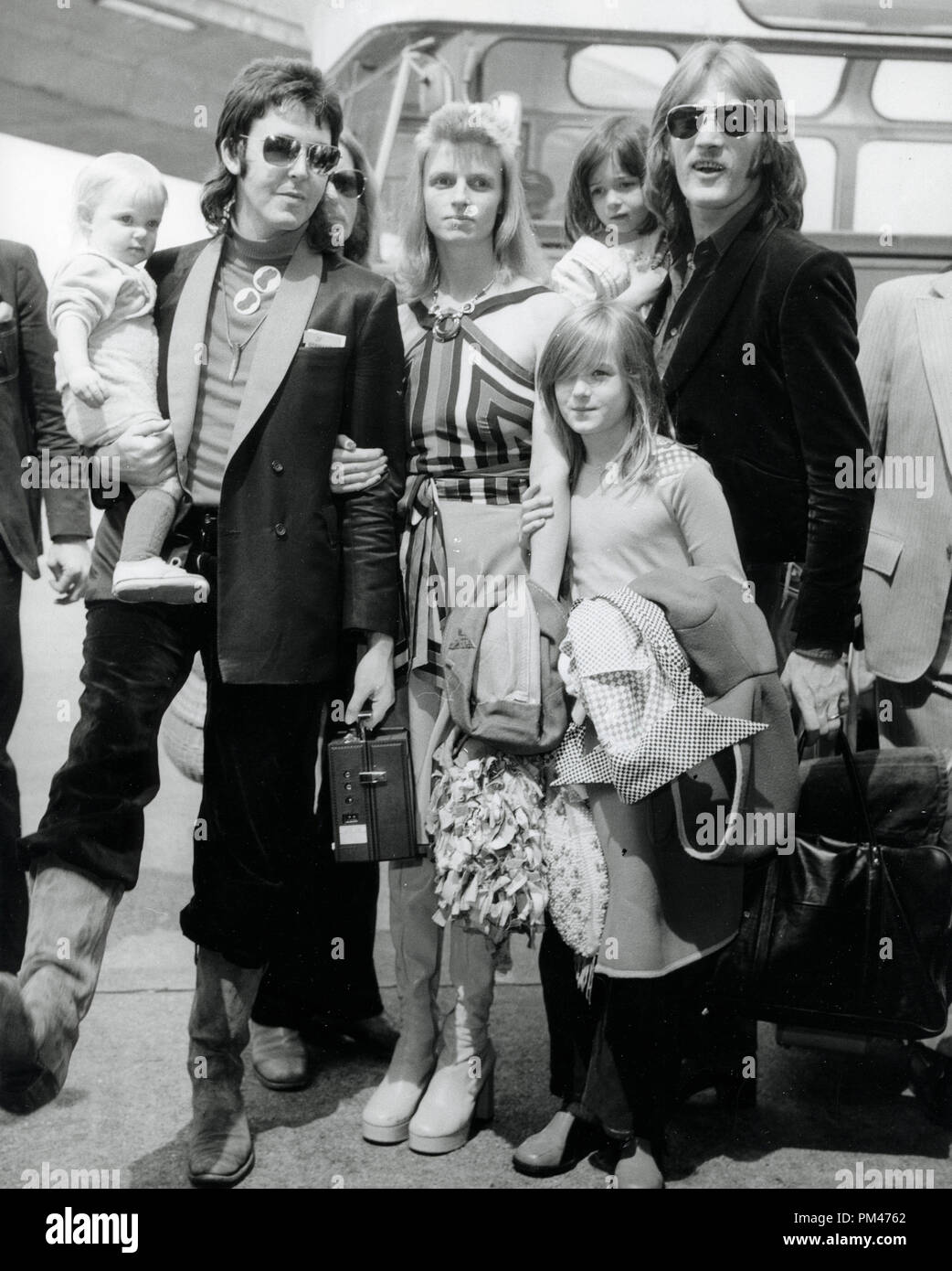 Paul McCartney and Linda McCartney, with daughter Stella in his arms and Heather holding Linda's arm, 1973.  File Reference # 1105_004THA Stock Photo