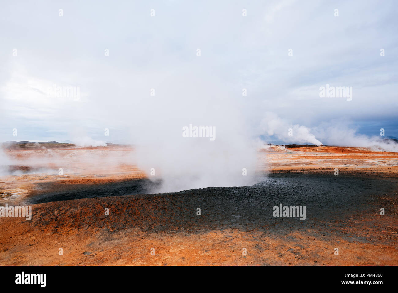 Namafjall - geothermal area in field of Hverir. Landscape which pools of boiling mud and hot springs. Near Myvatn Lake in Iceland Stock Photo