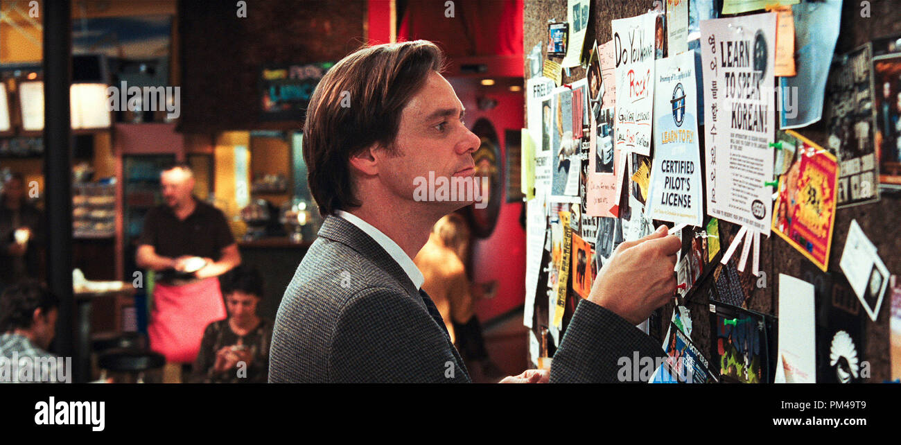 Carl (JIM CARREY) looks over the bulletin board in Warner Bros. Pictures' and Village Roadshow's comedy 'Yes Man,' distributed by Warner Bros. Pictures. Stock Photo