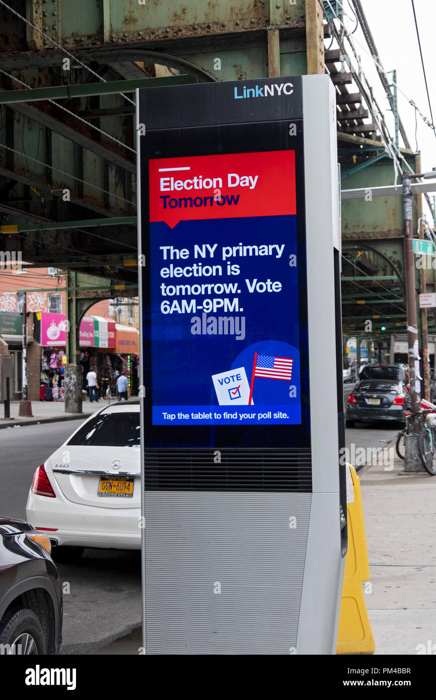 A public service message on a LINK NYC screen encouraging people wioth green cards to file for citizenship. In Woodhaven, Queens, New York City. Stock Photo
