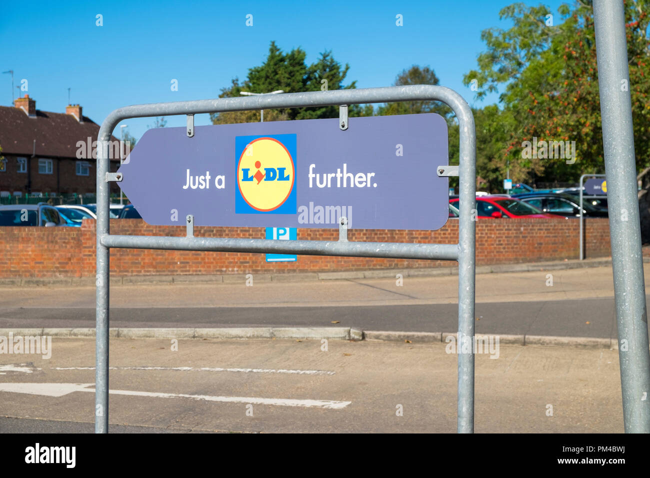 Just a lidl further logo entrance to car park, lidl store, ashford, uk
