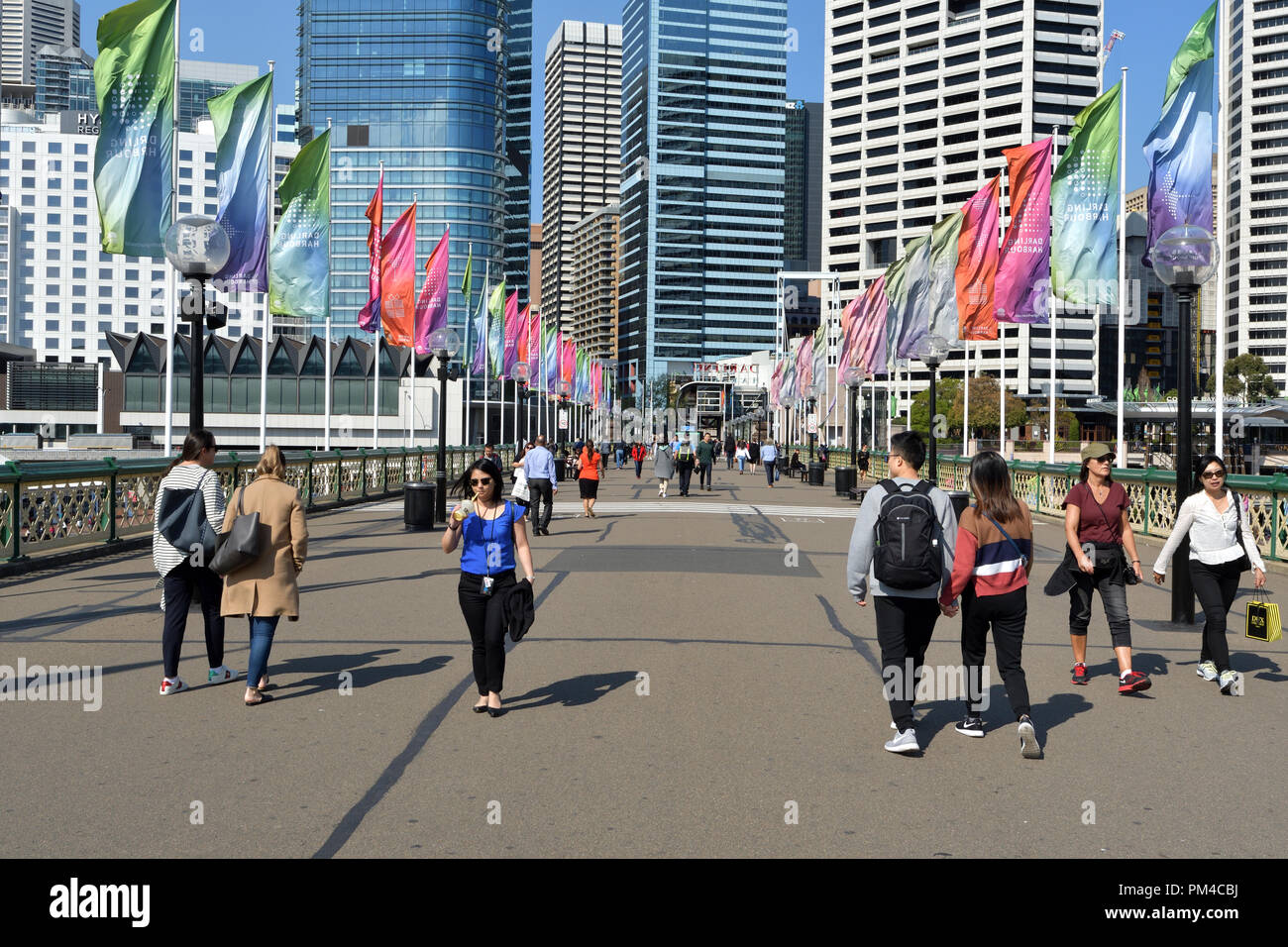 People Walking On Pyrmont Bridge In Darling Harbour Sydney Australia. Stock Photo