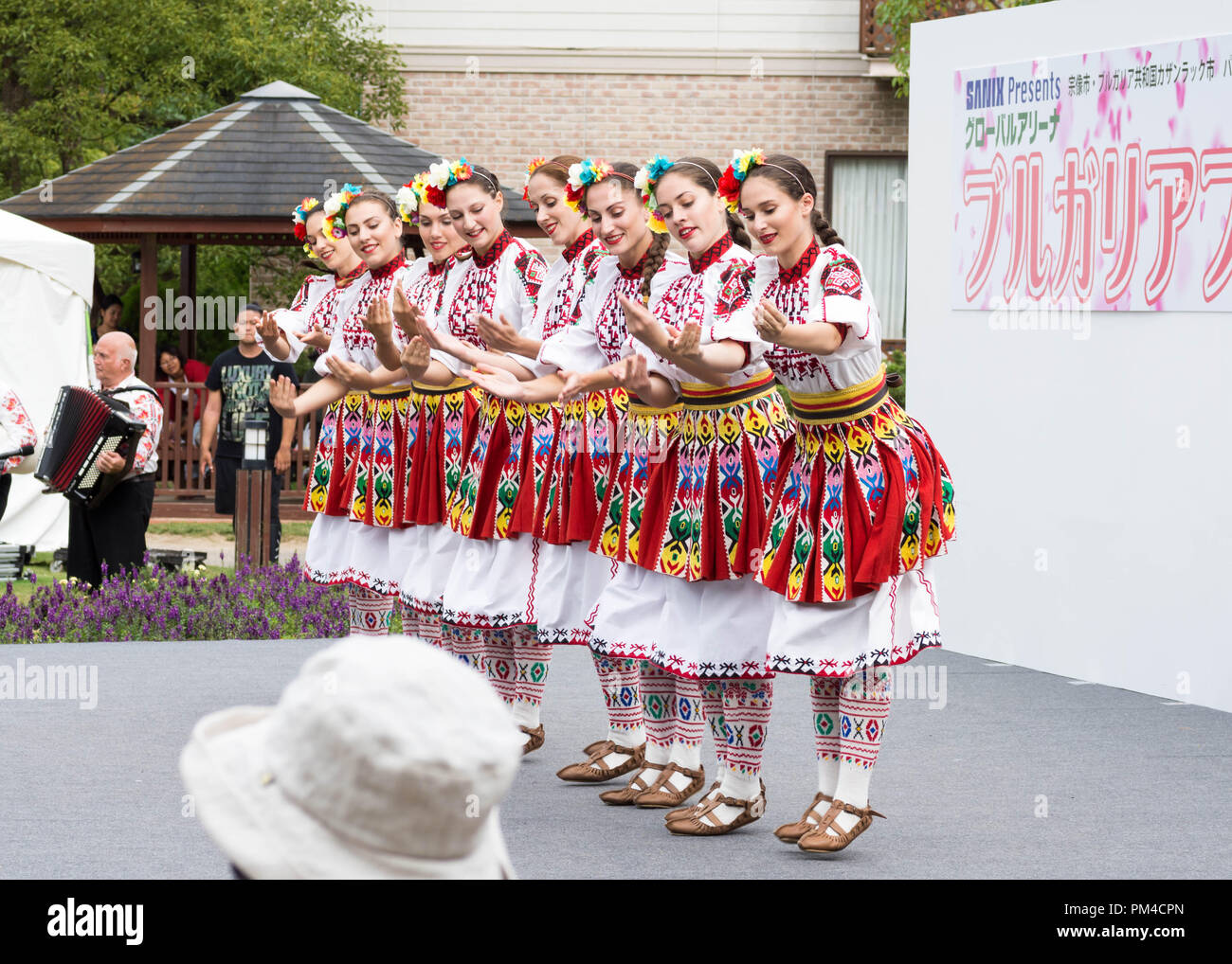 Women in Bulgarian traditional dress dance Bulgarian Folk dance on stage during Bulgaria Festival 2018 in Munakata City, Fukuoka, Japan Stock Photo