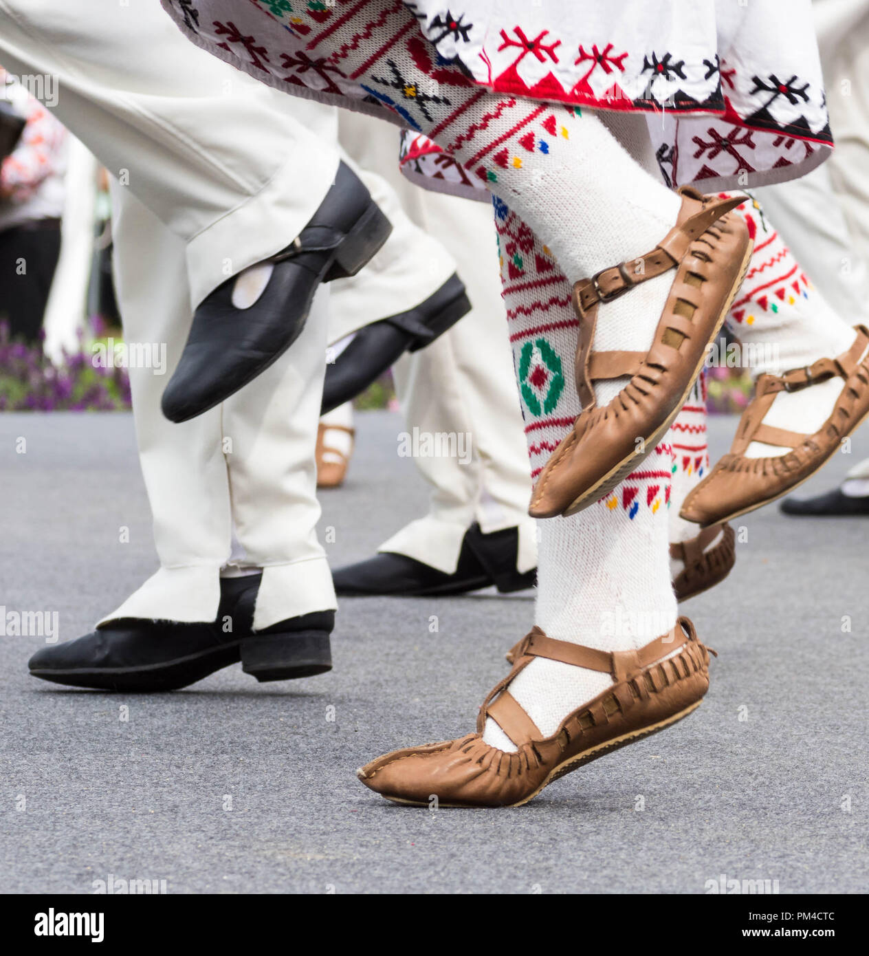 Bulgarian dancers feet in traditional clothes and shoes dancing Bulgarian Folk dance during Bulgaria Festival in Munakata, Fukuoka, Japan 2018 Stock Photo