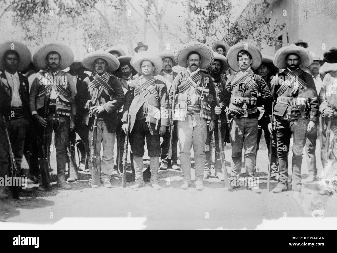 Mexican revolutionary general Francisco 'Pancho' Villa and Calixto Contreras (4th from right), circa 1910.  File Reference # 1002 016THA Stock Photo