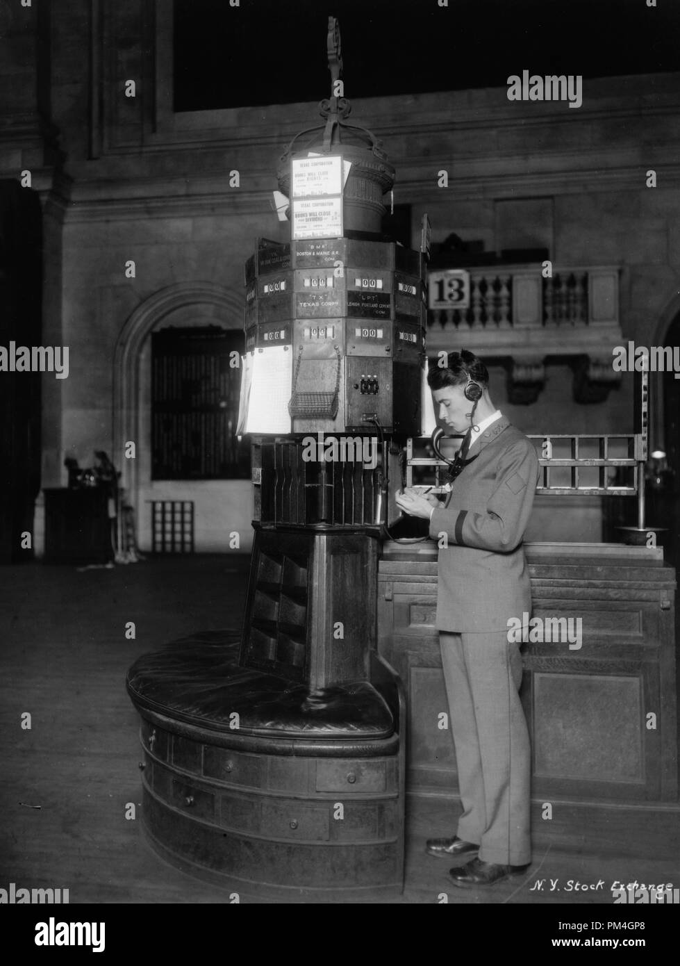 Telephone operator at post, new quotation system, New York Stock Exchange, circa 1928.  File Reference # 1003 082THA Stock Photo