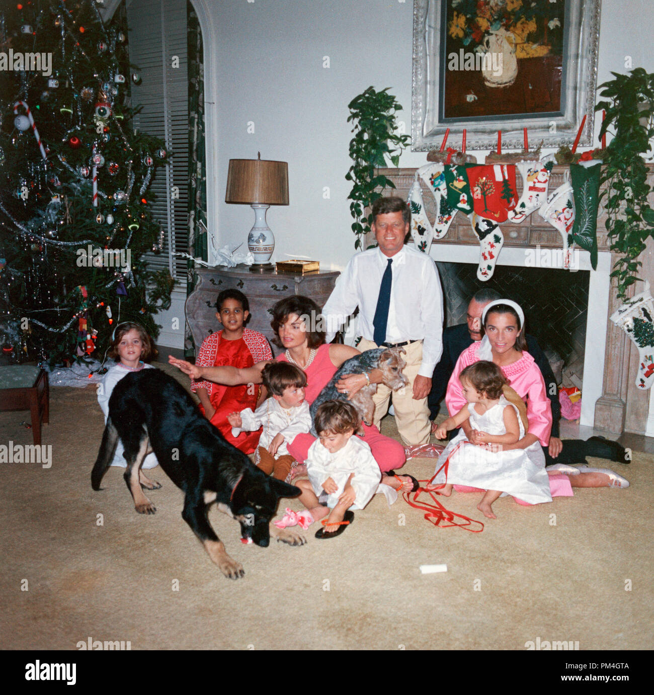 President John F. Kennedy and First Lady Jacqueline Kennedy with their family on Christmas Day at the White House, Washington, D.C., December 25, 1962. (L-R): Caroline Kennedy, unknown, John F. Kennedy Jr., Anthony Radziwill, Prince Stanislaus Radziwill, Lee Radziwill, and their daughter, Ann Christine Radziwill. (Photo courtesy of JFK Library)  File Reference # 1003 108THA Stock Photo
