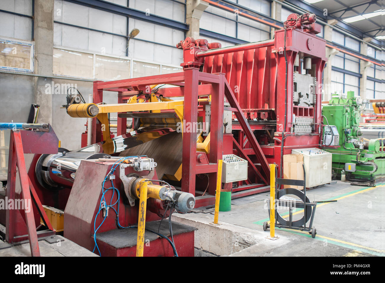 Huge machinery in factory for manufacturing metal works. Stock Photo