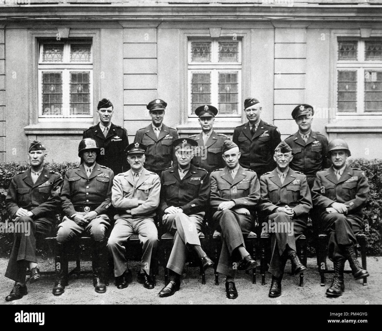 World War 2. Seated are Simpson, George Patton, Spaatz, Dwight D. Eisenhower, Bradley, Hodges and Gerow. Standing are Stearley, Vandenberg, Smith, Weyland and Nugent.' Circa 1945.   File Reference # 1003 149THA Stock Photo