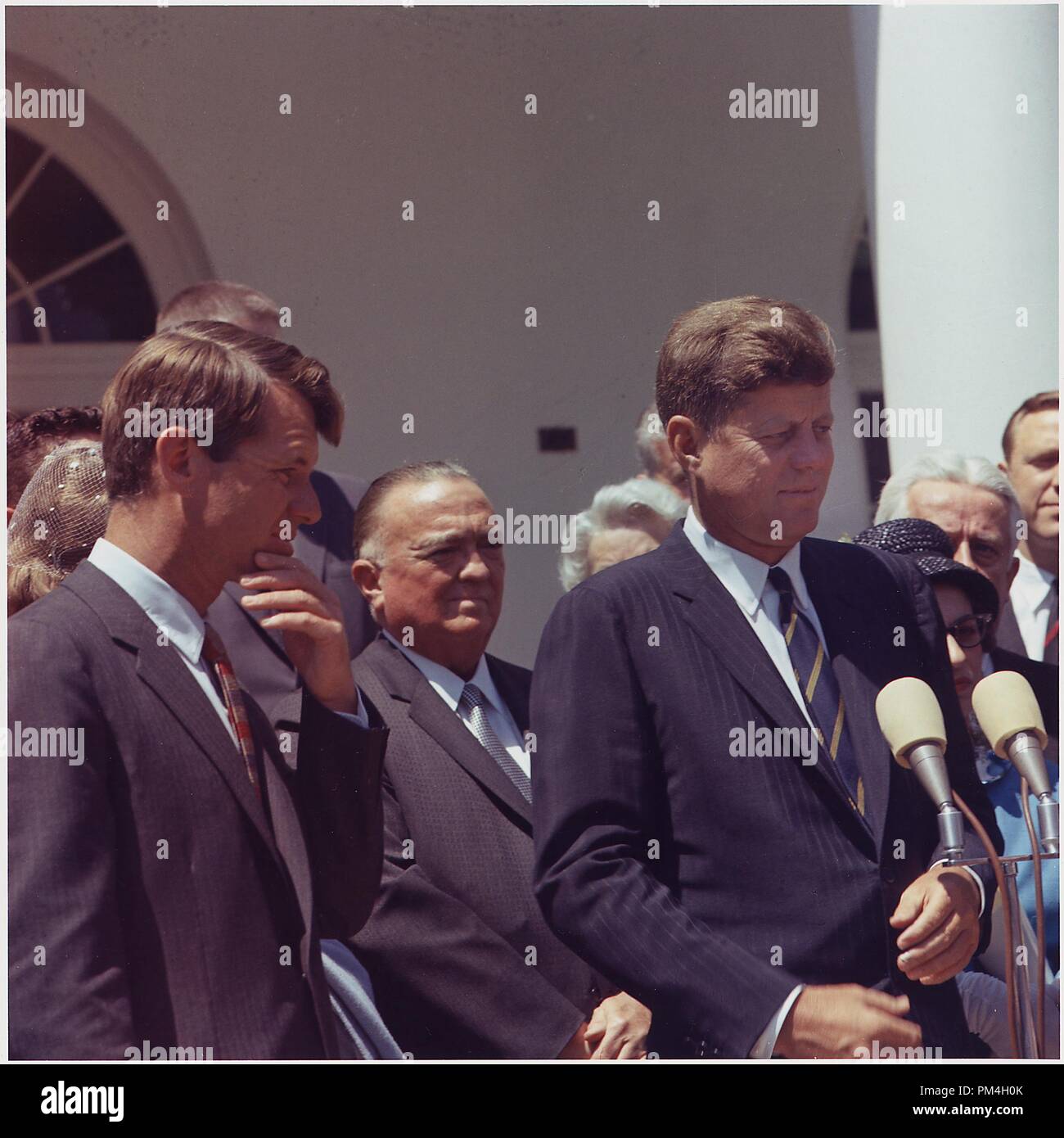 Presentation of the Young American Medals for Bravery. Attorney General Robert F. Kennedy, Director of F.B.I. J. Edgar Hoover, President John F. Kennedy, others. White House, Rose Garden, 7 May 1963     File Reference # 1003 165THA Stock Photo