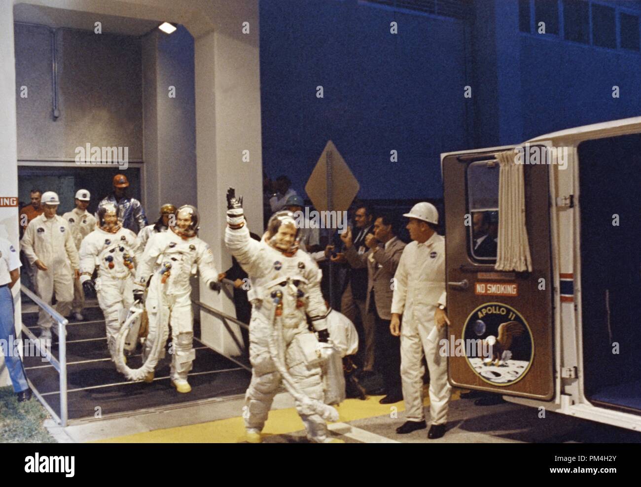 Apollo 11 Commander Neil A. Armstrong leads astronauts Michael Collins and Edwin E. Aldrin, Jr., from the Manned Spacecraft Operations Building to the transfer van for the eight-mile trip to Pad 39A. July 16, 1969  File Reference # 1003 198THA Stock Photo