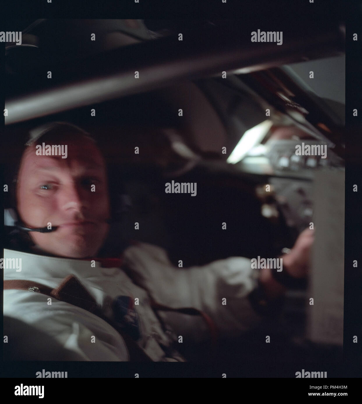 Astronaut Neil A. Armstrong in the Command Module on July 1969's  history making voyage to the moon and subsequent lunar landing.  File Reference # 1003 207THA Stock Photo