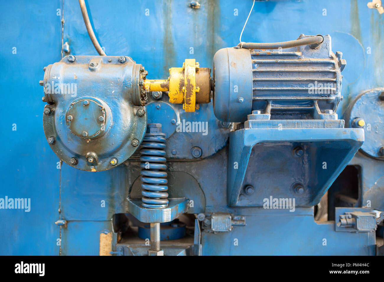 Part of a machine. Close up blue machine motor. Stock Photo