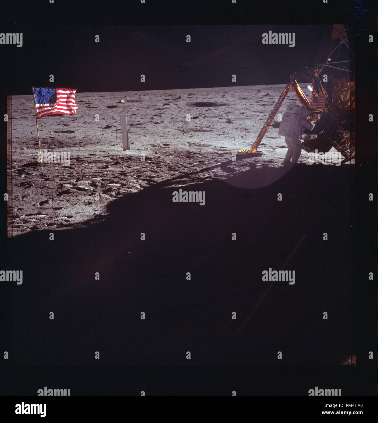 The American flag and Lunar landing module on the moon during July 20, 1969's  history making voyage to the moon.  File Reference # 1003 264THA Stock Photo