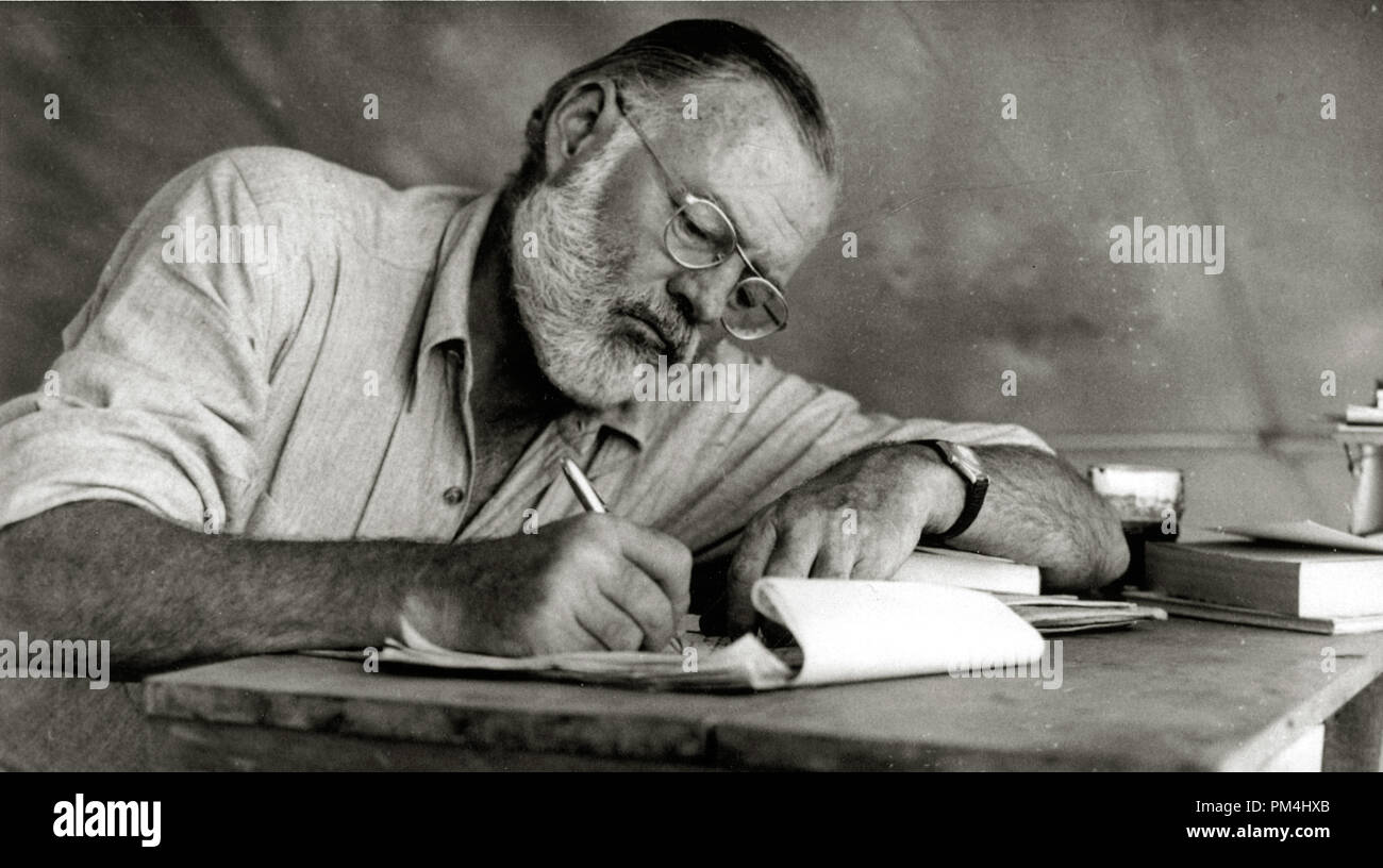 Ernest Hemingway Writing at Campsite in Kenya, circa 1953  File Reference # 1003 429THA Stock Photo