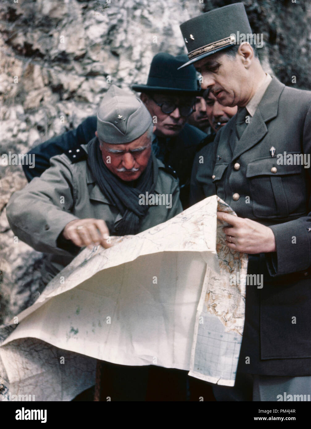 General Charles de Gaulle looking over a map, circa 1943   File Reference # 1003 522THA Stock Photo