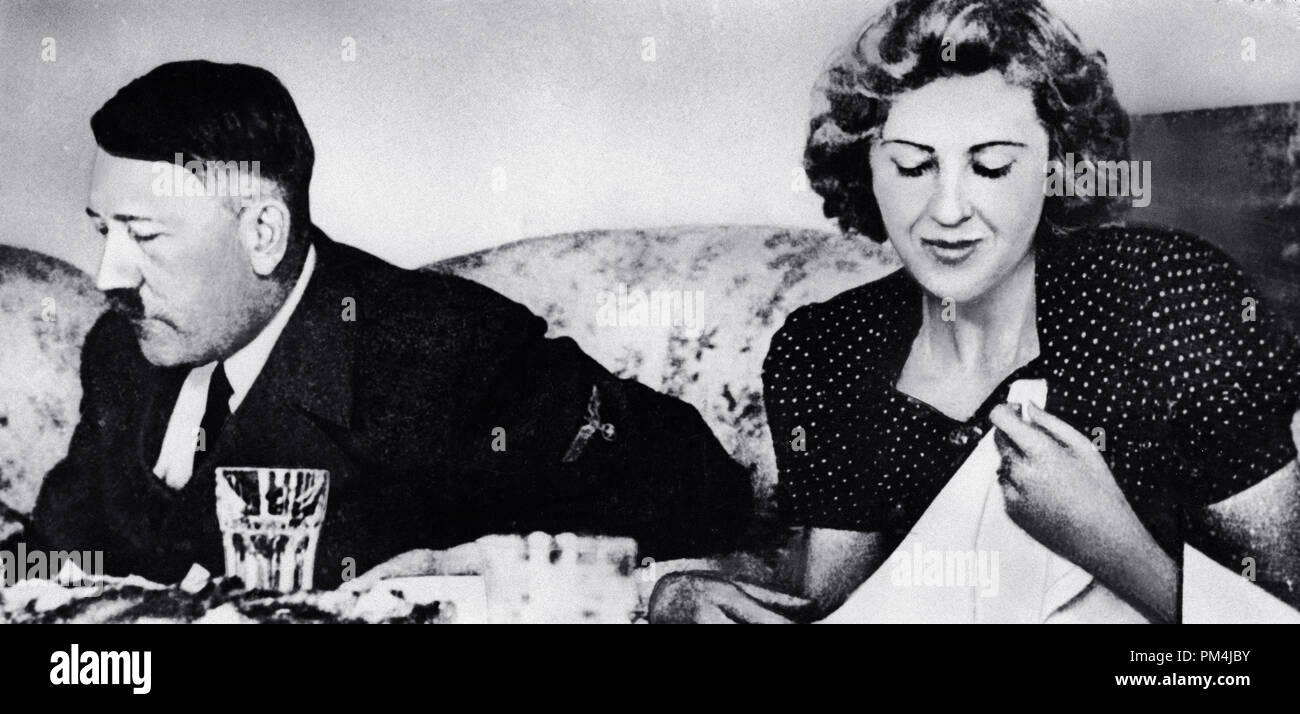 German dictator Adolf Hitler and his mistress Eva Braun dine in a still from a private home movie made by Braun's sister Gretl Fegelein, circa 1942   File Reference # 1003 660THA Stock Photo