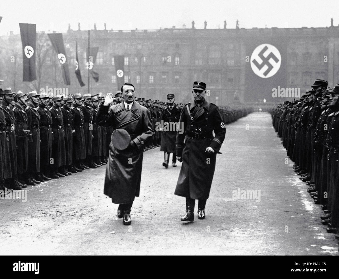 German army officer Viktor Lutze accompanies German leader Adolf Hitler on a review of the army in Berlin, to commemorate the third anniversary of Hitler's regime, circa 1936   File Reference # 1003 662THA Stock Photo