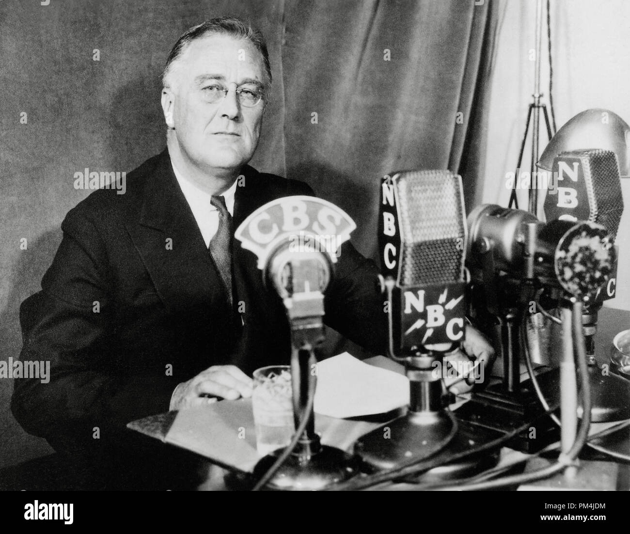 President Franklin D. Roosevelt, 1934, during fireside chats, a series of 30 evening radio conversations (chats) given by U.S. President Franklin D. Roosevelt between 1933 and 1944.  File Reference # 1003 680THA Stock Photo
