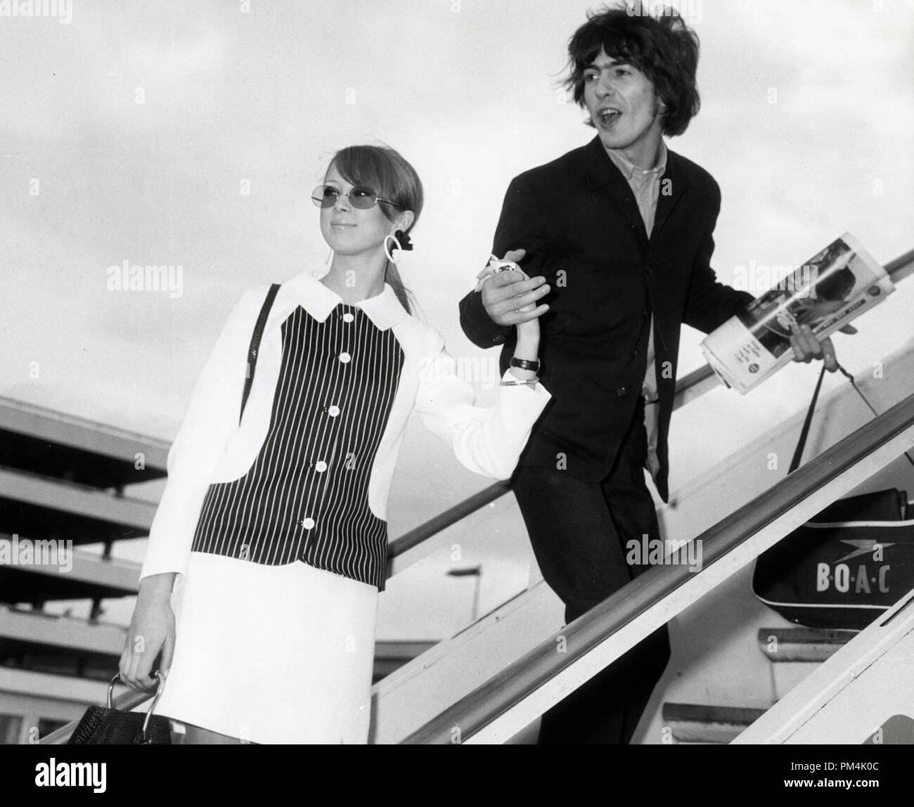 Beatle George Harrison and his wife Pattie boarding a plane headed for Barbados,1966.  File Reference #1013 124 THA © JRC /The Hollywood Archive - All Rights Reserved. Stock Photo