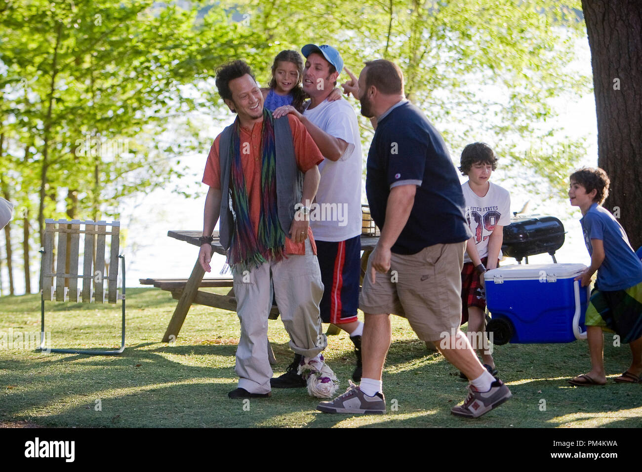 Rob (Rob Schneider), Lenny Feder (Adam Sandler) carrying his daughter Becky (Alexys), Eric (Kevin James), Feder boys Greg (Jake Goldberg) and Keithie (Cameron Boyce) carrying the ice chest to the hayride in Columbia Pictures' GROWN UPS. Stock Photo