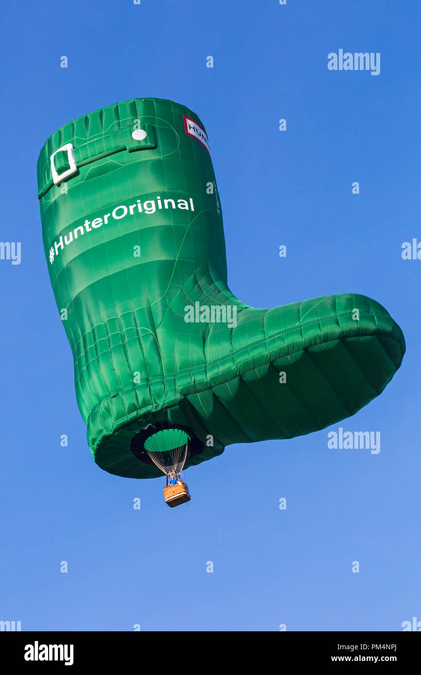 Hunter original wellington boot hot air balloon in the sky at Longleat Sky Safari, Wiltshire, UK in September Stock Photo