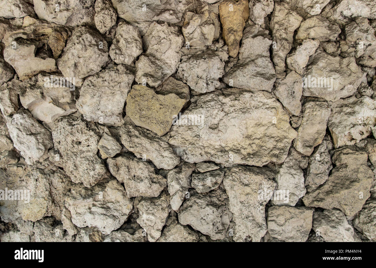 Texture of an old stone wall. Close-up Stock Photo - Alamy